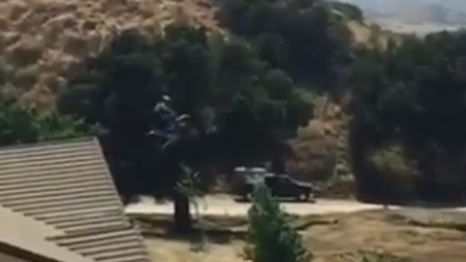 Motocross bike jumps house